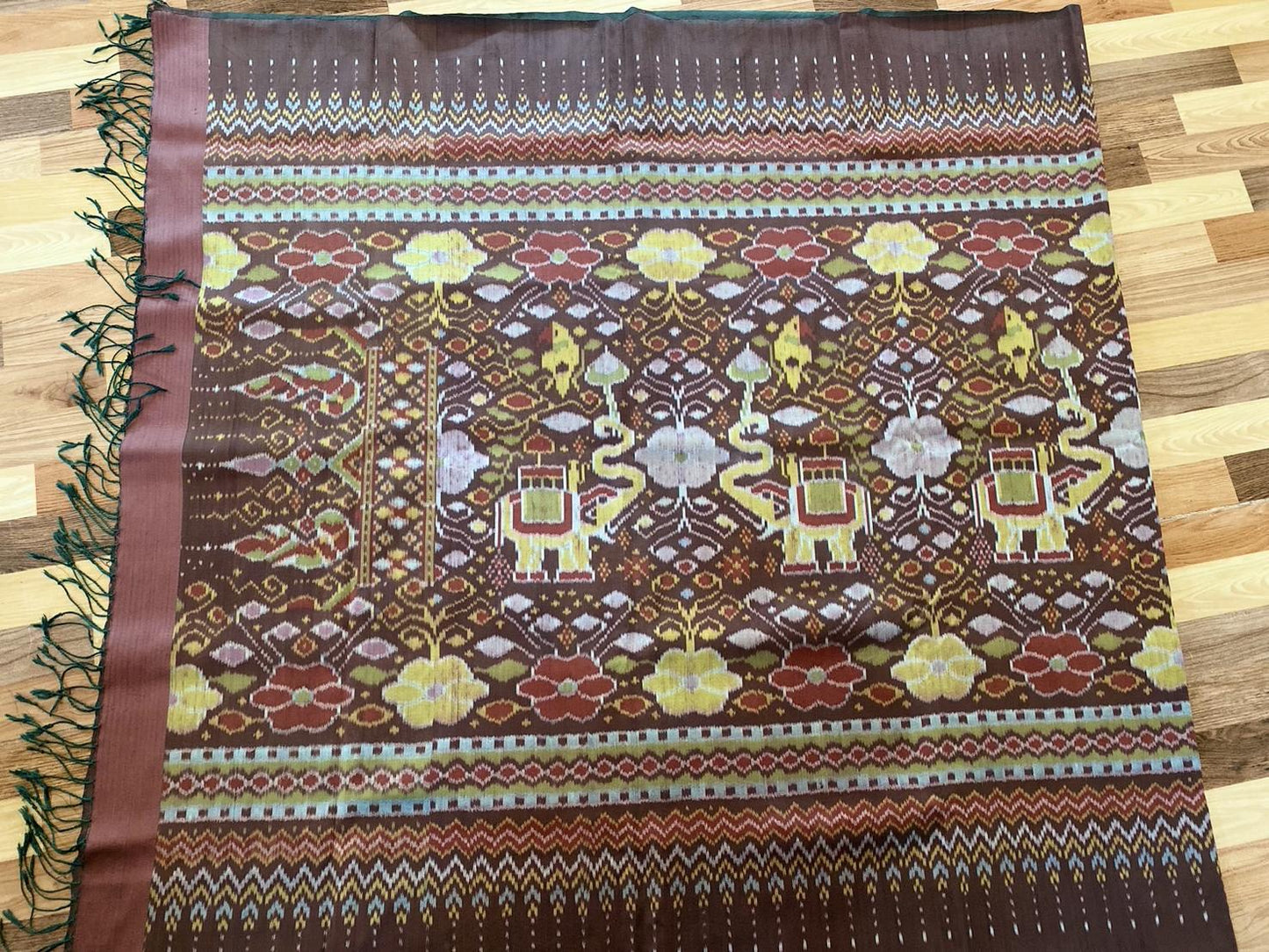 Mudmee silk sarong, real silk, natural color, fermented in mud, 3 tako, woven on a coaster, size 1x2 meters, flower pattern, Chang Chu Chat pattern, brown, code M3P-33-0208673.