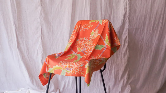 Handwoven silk, painted batik, shades of orange, sold by the yard, code A11-CT-102049.