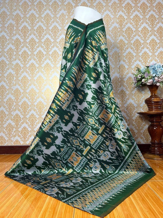 Mudmee silk skirt, woven with 6 takok flowers, size 1x2 meters, elephant, horse, castle pattern. Has a frieze-covered lady's face, green background, code M2A-KN-07076721462