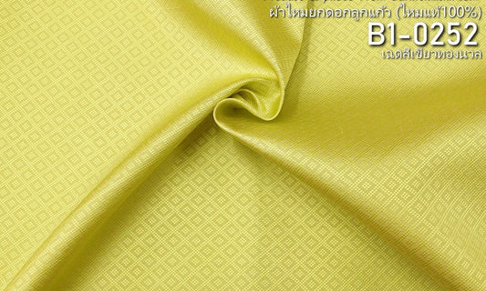 Yok Dok Luk Kaew silk, plain color, pure silk, 8 tako, soft green and gold color. Sold by the yard, code B1-0252